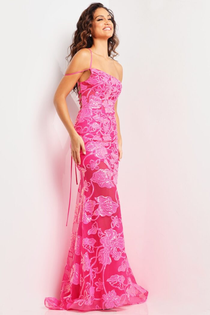 Model showcasing Jovani 38463 pink gown, showing intricate floral design and fit.