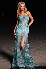 Model showcasing Jovani 38468 blue dress with beading and high slit detail.