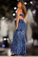 Model wearing Jovani 38471 black dress with strappy back, back view.