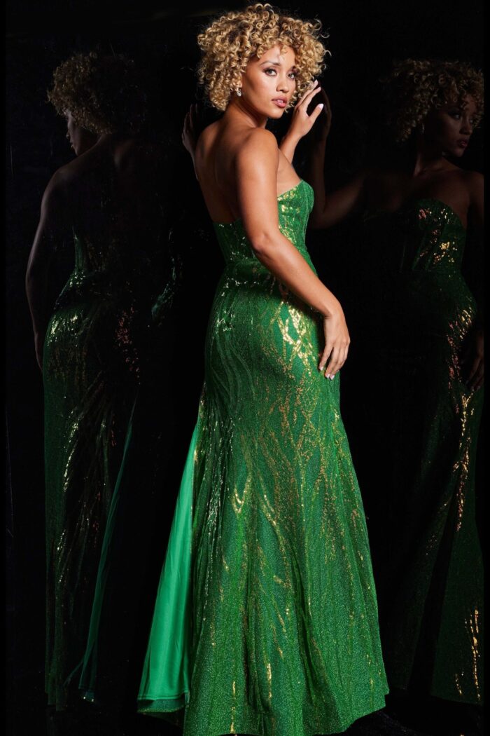 Back view of model wearing Jovani 38598 green gown with shimmering sequins.
