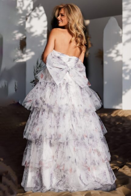 Ivory ball gown Jovani 38608 with floral motifs and tulle structure.