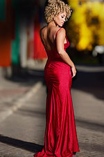 Back view of Jovani 38817 dress showcasing a low-cut design in red
