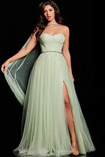 Model wearing Jovani 39307 mint green gown with sweetheart neckline and high slit.