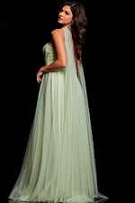 Back view of Jovani 39307 mint green gown with flowing cape-like detail.