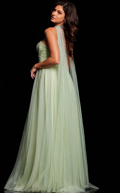 Back view of Jovani 39307 mint green gown with flowing cape-like detail.
