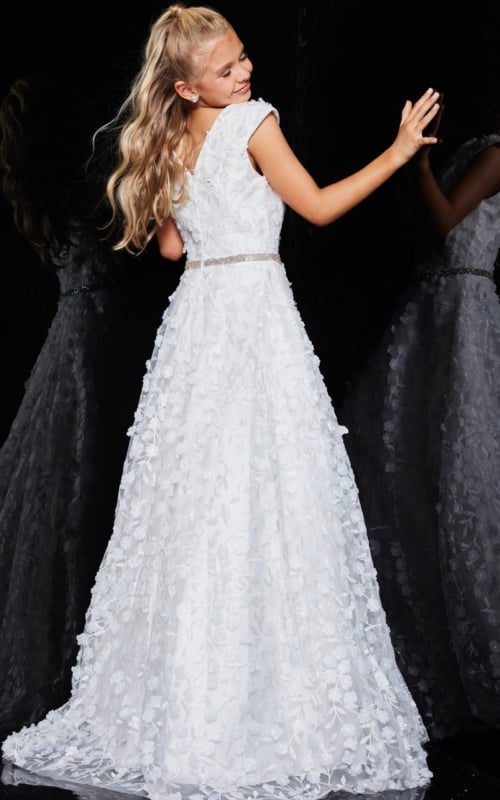 Back view of model in Jovani K07245 ivory gown with cap sleeves and floral appliqué.