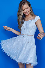 Model showing Jovani K07283 light blue dress with embellished details.