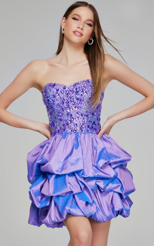 Model wearing Jovani K07390 lilac short dress with beaded sweetheart neckline and ruffled skirt, front view.