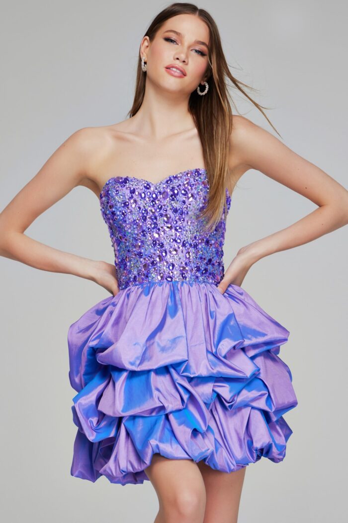 Model wearing Jovani K07390 lilac short dress with beaded sweetheart neckline and ruffled skirt, front view.