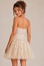 back view of ivory floral lace fit and flare dress with corset back and tulle skirt