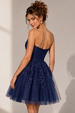 back view of navy floral lace fit and flare dress with corset back
