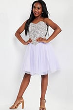 Model in Jovani K22231 lilac dress, sweetheart neckline and full tulle skirt.