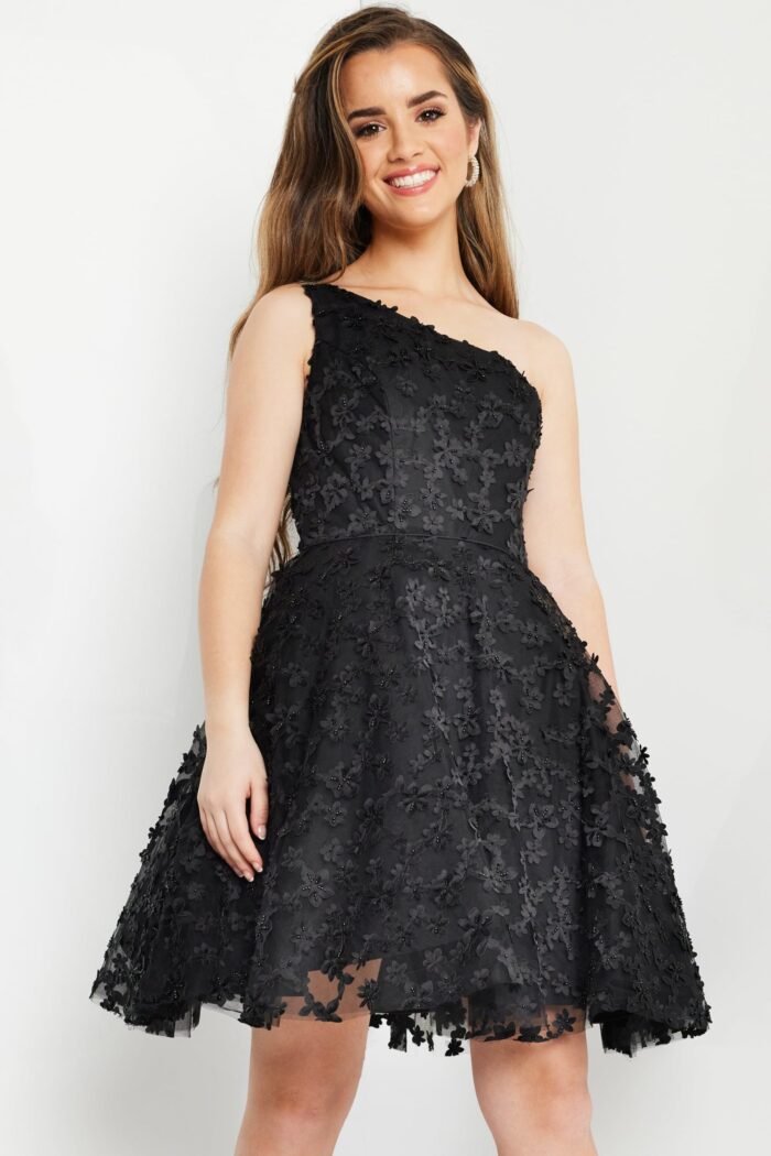 model wearing K23516 black dress, detailed front view, highlighting the texture.