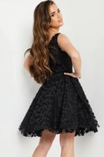 model in K23516 black dress, side-back view, showcasing intricate design.