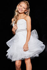 model wearing Jovani K23518 white dress featuring elegant ruffles