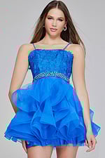 Model wearing Jovani K23518 blue dress with lace bodice and jeweled waist