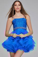Model posing in Jovani K23518 blue dress showing lace details