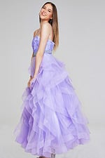 Jovani K23519 lilac gown with ruffled tulle skirt, side view.