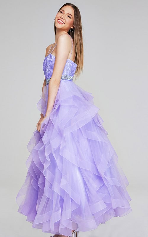 Jovani K23519 lilac gown with ruffled tulle skirt, side view.