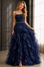 Elegant navy dress with straight neckline, layered ruffles, and sparkling belt.