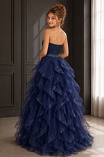 back view of navy ruffled ball gown with lace bodice and zip back