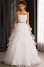 white ruffled ball gown with textured bodice, beaded belt and spaghetti straps