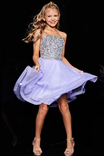 model in Jovani K23666 dress twirling in lilac layers