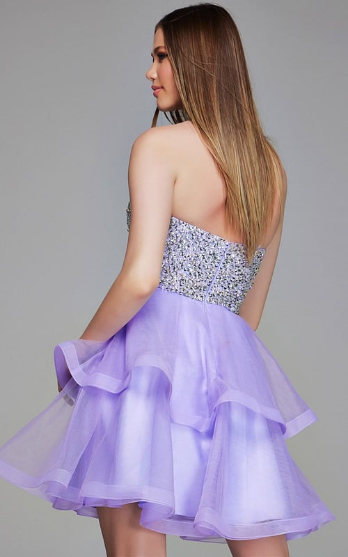 Model wearing Jovani K23666 lilac dress, back view showing sequined bodice.