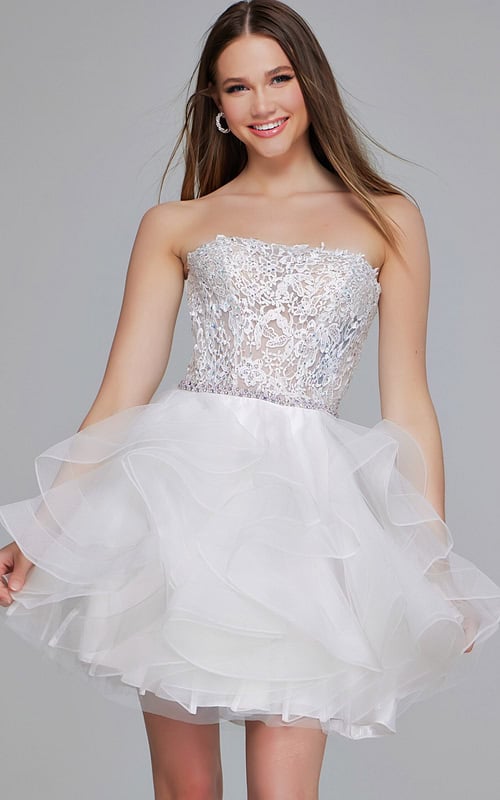 Model wearing Jovani 24371 white dress with strapless lace bodice and tulle skirt, front view.