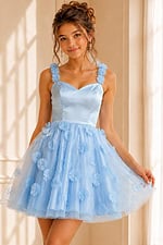 Light blue tulle dress adorned with white and blue flowers