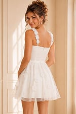 back view of white floral applique dress with floral shoulder straps