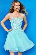Model in Jovani K3641 blue dress showcasing the detailed bodice, front view