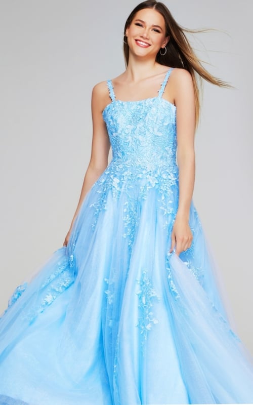 Model wearing Jovani K38098 light blue dress with intricate detailing from the front