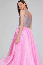 Model showing back of Jovani K38261 pink gown with glitter bodice.