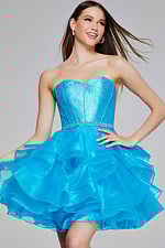 Model in Jovani K39311 turquoise mini dress, highlighting ruffled skirt and fitted bodice.