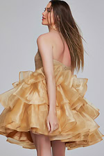 Model wearing Jovani K39312 dress in gold, back view