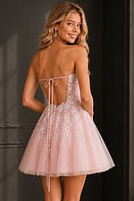 back view of pink dress with lace up corset back and tulle skirt