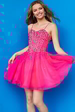 Model in vibrant pink Jovani K59903 with shimmering embellishments