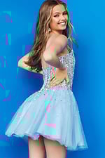 Model in front view of Jovani K59903 in white with sequins