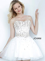 Model wearing Jovani K62533 white dress with a sparkling bodice and A-line skirt from the front.