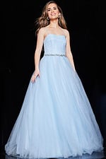 Model wearing Jovani K66712 blue ball gown front view with beadwork belt.