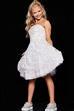 Young model in Jovani K68026 white dress, front view showing strapless design.