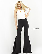 Model wearing Jovani M02807 jumpsuit, front view highlighting halter neckline.