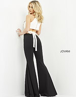 Model wearing Jovani M02807 jumpsuit, back view showcasing open back and tie detail.