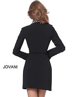 Model wearing Jovani M03416 black dress, back view, with long sleeves and fitted design.
