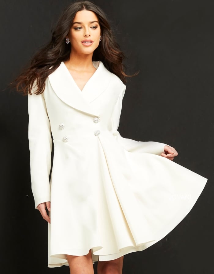 model displaying Jovani M04302 off-white dress with decorative buttons
