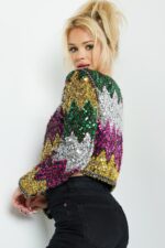 Model wearing Jovani M05037 sequin dress in vibrant colors.
