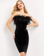 Front view of model in M3335 black dress with feather detail and strapless neckline.