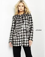 Model wearing M3393 front view black and ivory houndstooth dress with classic design.