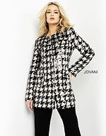 Front view of model wearing M3393 black and ivory houndstooth dress.